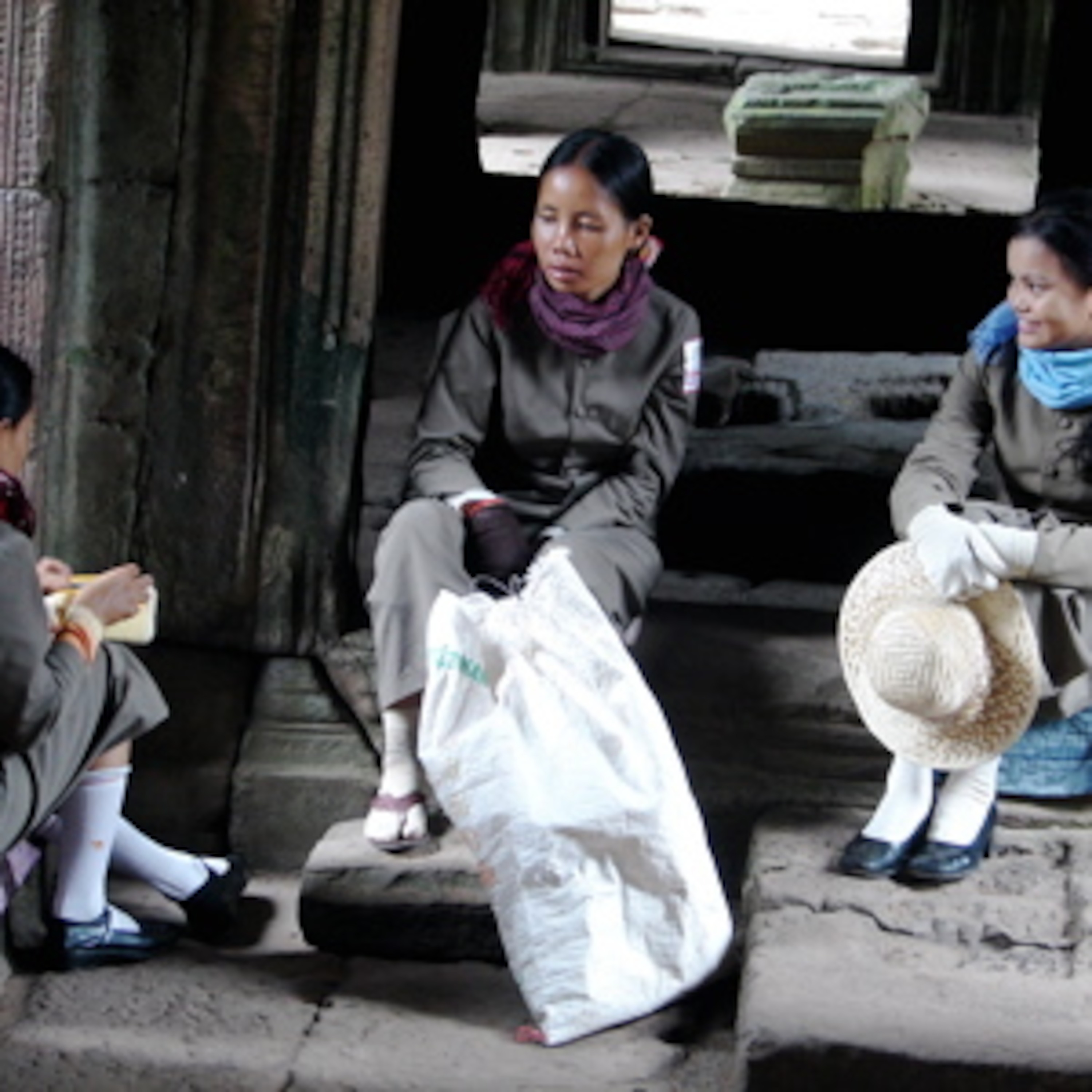 Girls in Preah Khan, chatting and laughing, radio